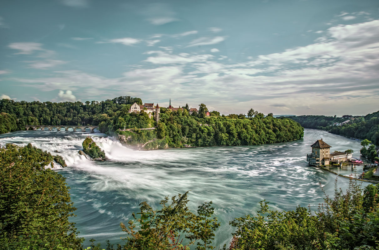 The Rhine Falls in Schaffhausen in blue light, symbolic of image editing - n c ag