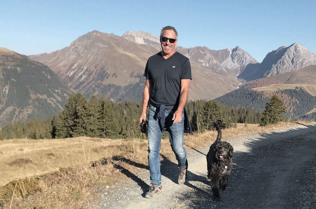 Mike Spoerri privately hiking with his dog in the mountains - n c ag
