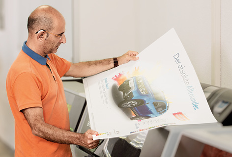 A man checks a digital proof, symbolic of Digital Proofs - n c ag