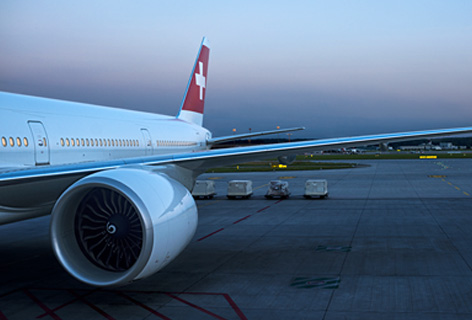 A cut-out of a SWISS airplane on a tarmac, emblematic of the SWISS customer - n c ag
